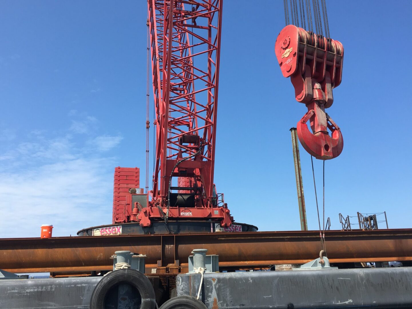 A red color crane at a construction site
